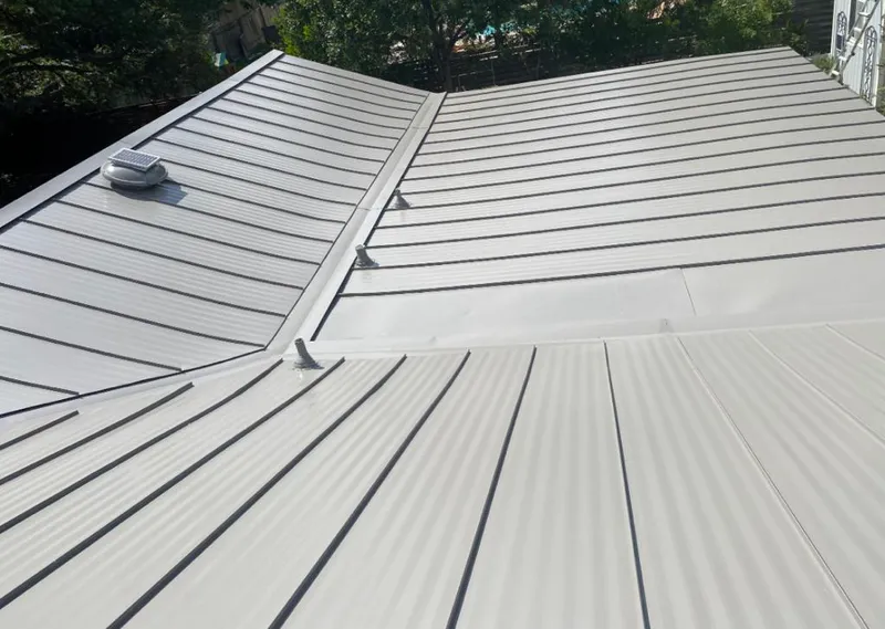 Solar attic fan installed on a metal roof for Roof Ventilation in Temple Hills